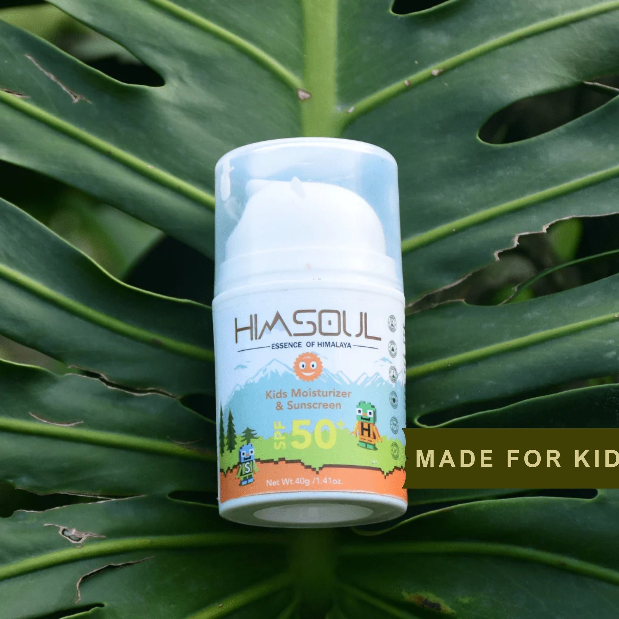 Himsoul Kids Moisturizer and Sunscreen bottle placed on a large green Monstera leaf, emphasizing the brand's plant-based and "Essence of Himalaya" identity.
