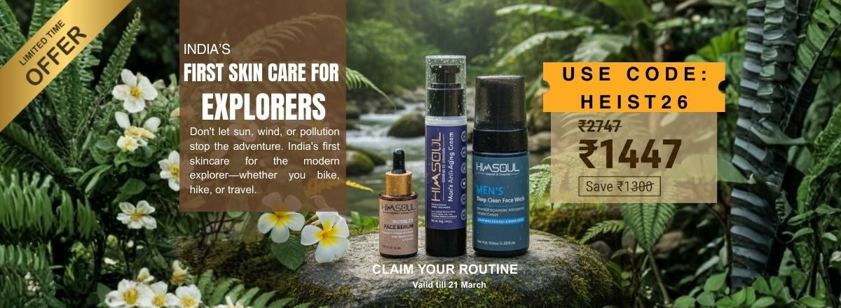 The Himsoul men's skincare kit—featuring Face Wash, Serum, and Anti-Aging Cream—placed on a mossy stone by a tropical river. The banner highlights India's first skincare for explorers who bike and hike, offering the Heist Kit at ₹1447 with code HEIST26.